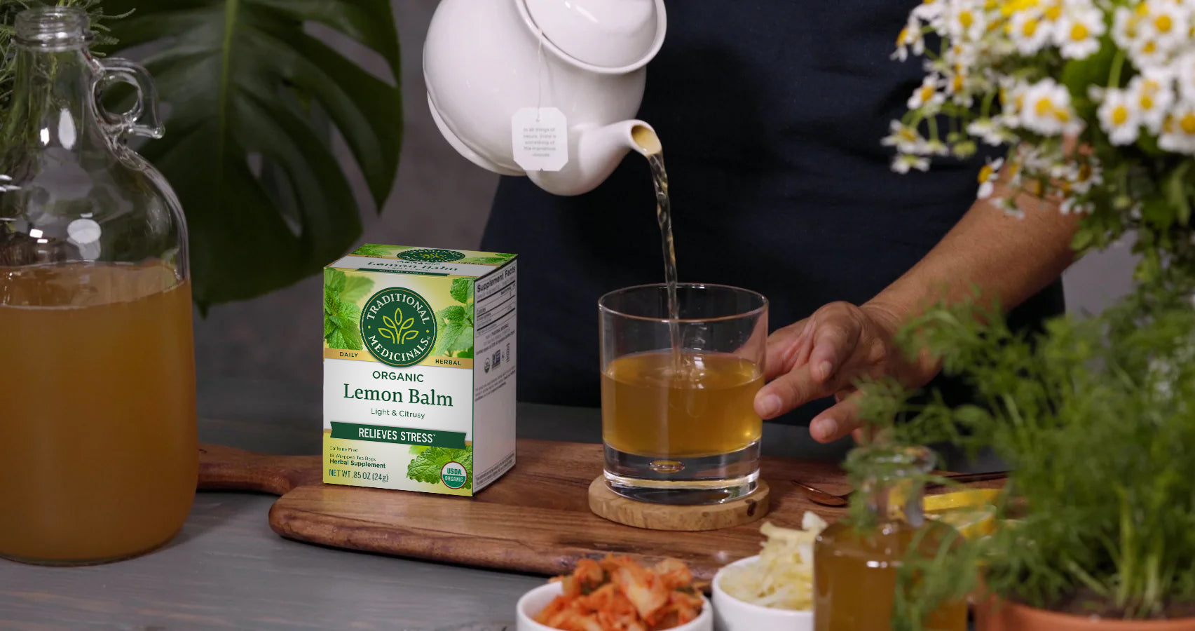 Lemon Balm Tea box and tea being poured into glass cup