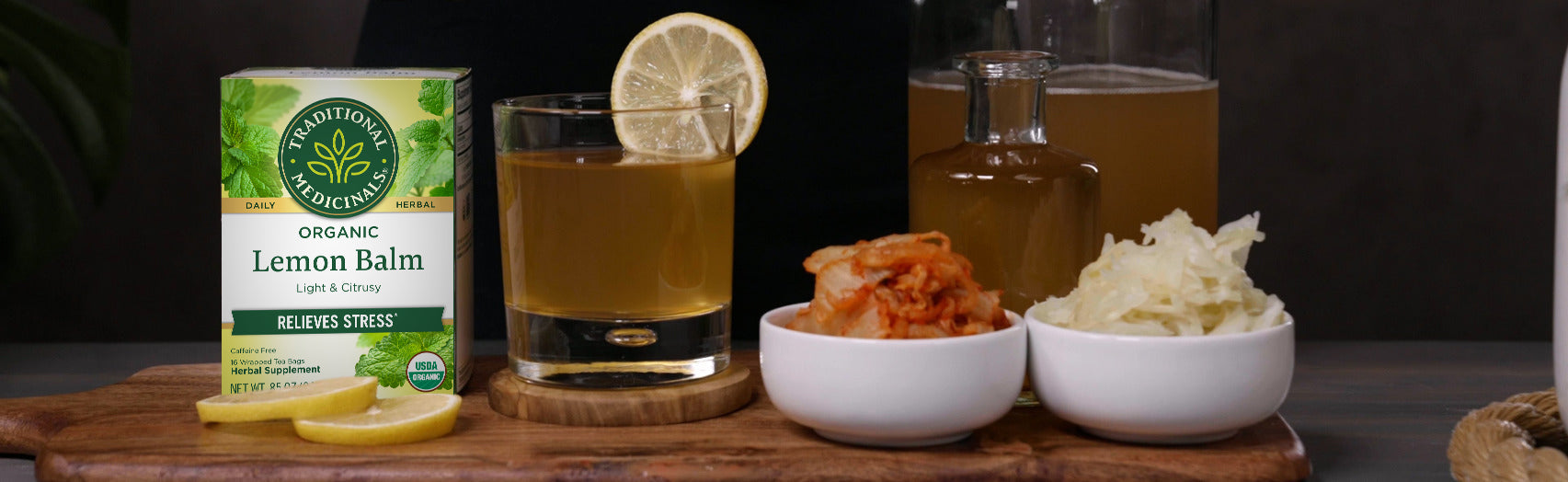 Lemon Balm Tea box on table with mocktail and ingredients