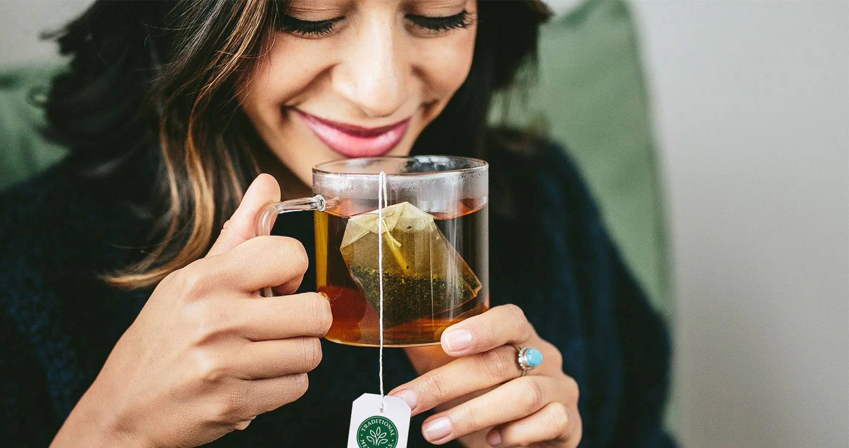 woman enjoying lemon balm tea