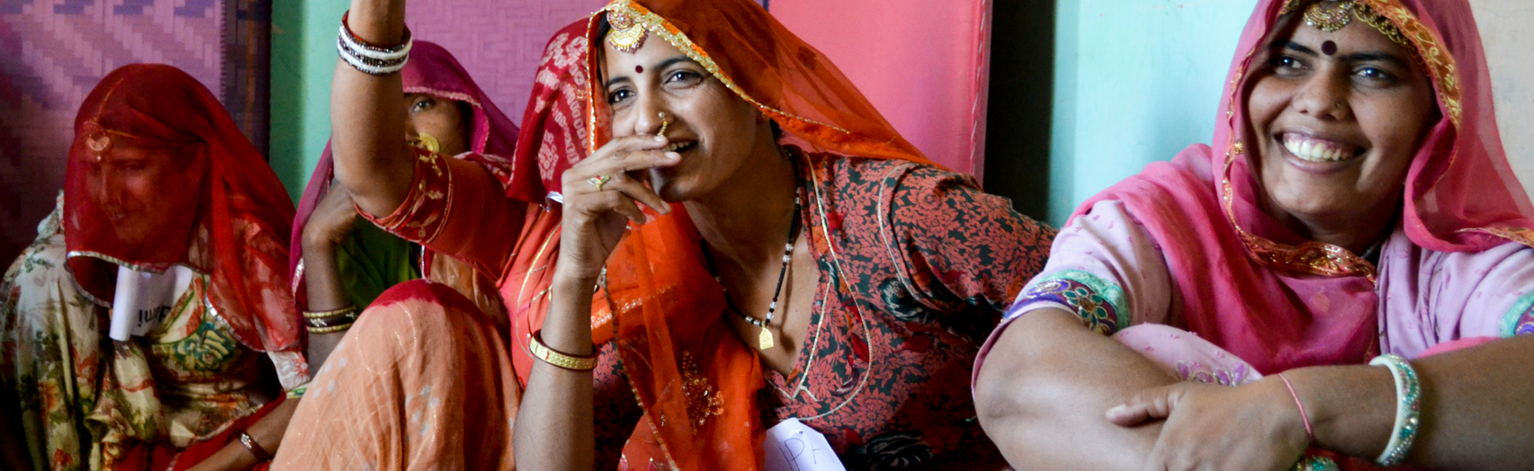 Indian women sitting together, laughing